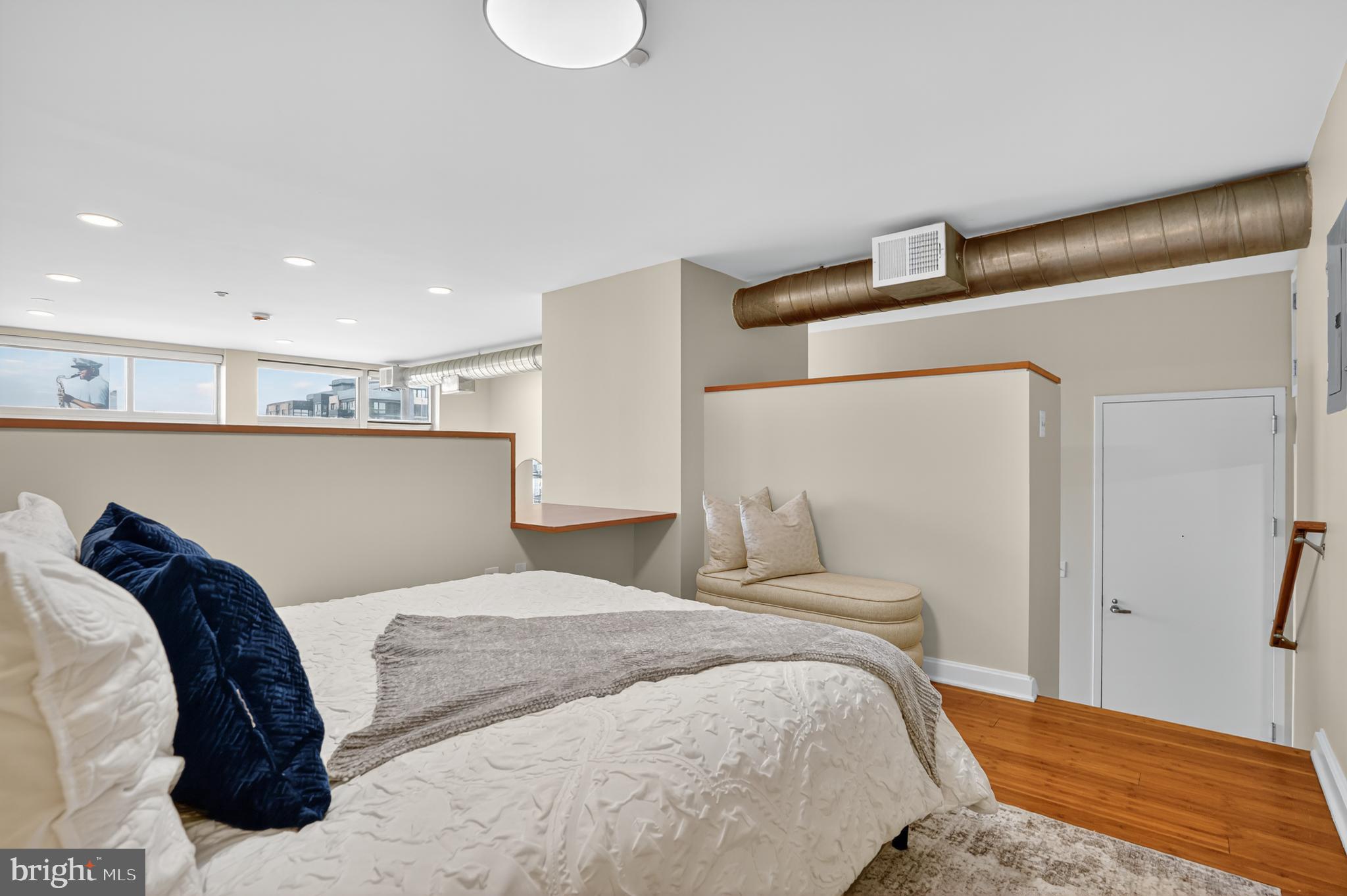 1390 V Street Northwest, Unit 306 Washington, DC 20009 - Photo 9 of 19 a bedroom with a bed and a mirror