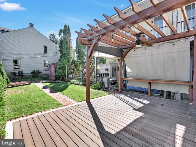 a view of a backyard with sitting area