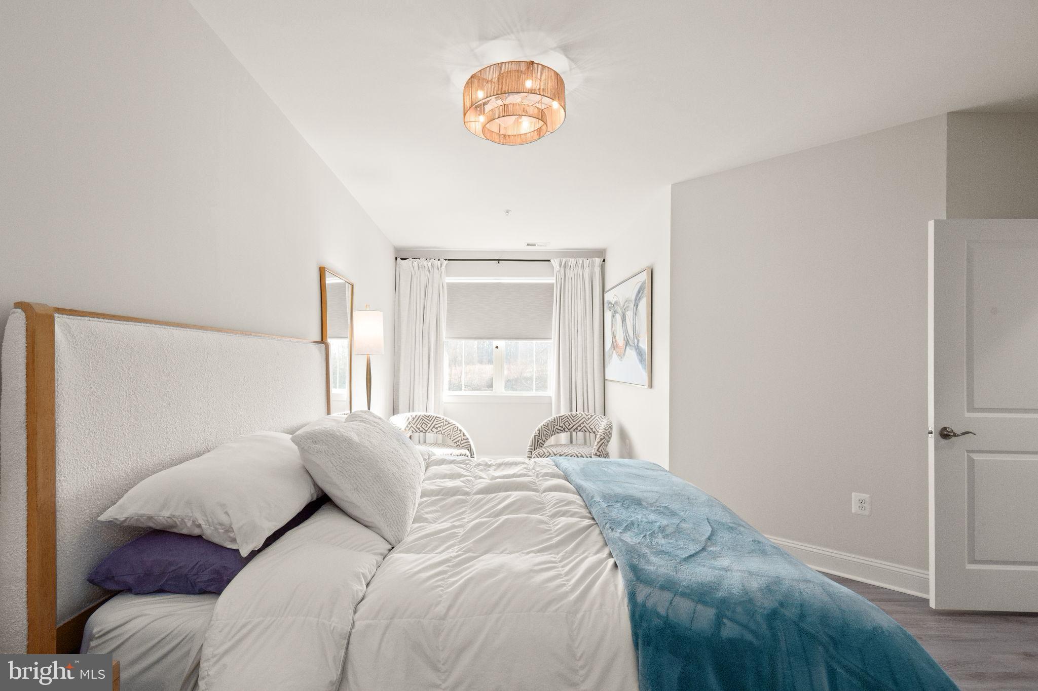 406 Bold Ruler Court, Unit 207 Havre de Grace, MD 21078 - Photo 15 of 57 a bedroom with a bed and a window