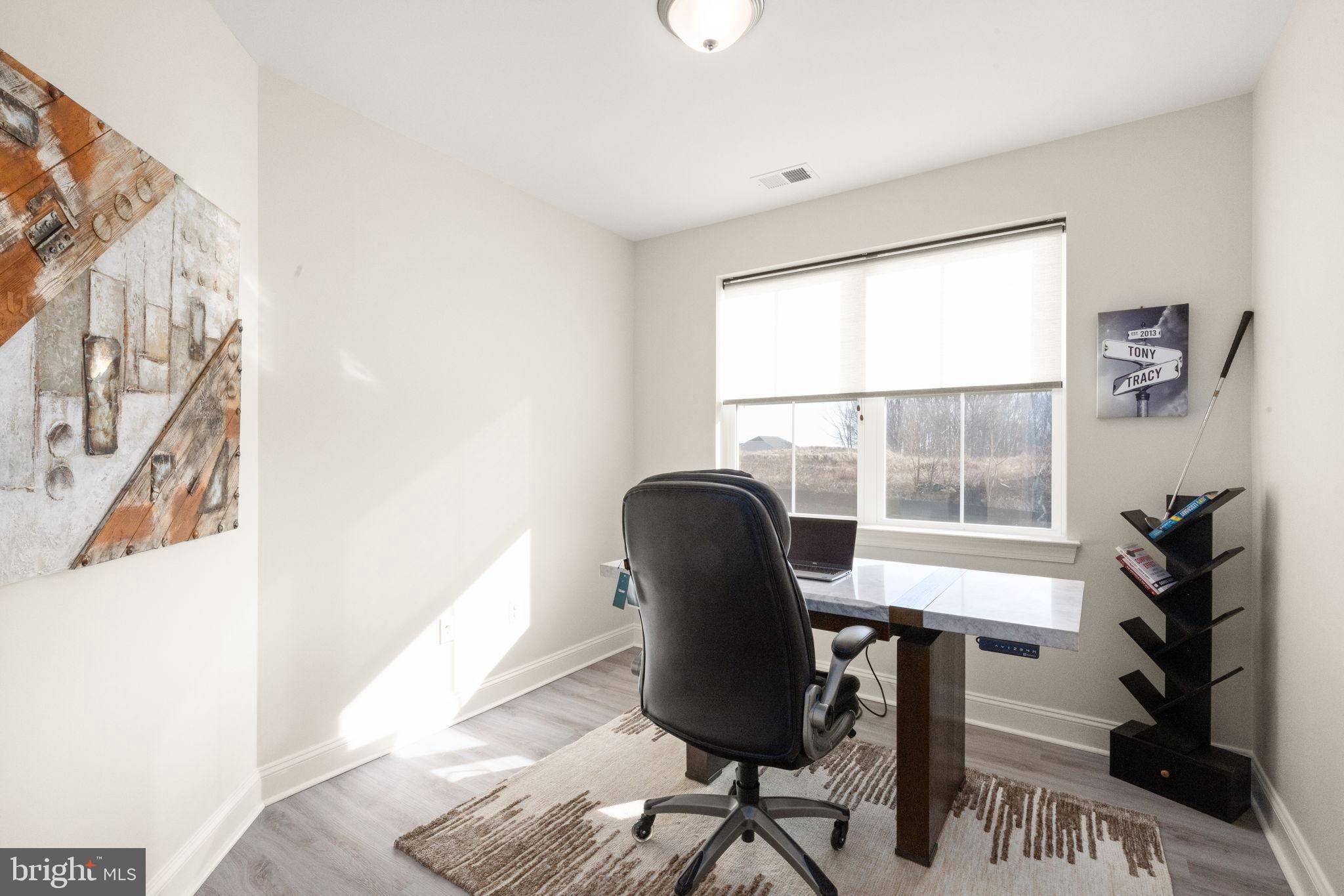 406 Bold Ruler Court, Unit 207 Havre de Grace, MD 21078 - Photo 16 of 57 a view of a workspace with furniture and a window