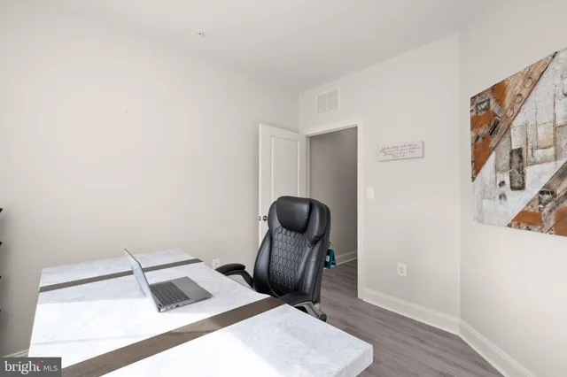 a room with furniture and wooden floor