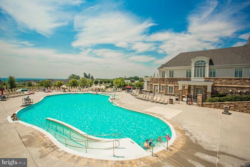 406 Bold Ruler Court, Unit 207 Havre de Grace, MD 21078 - Photo 2 of 57 a swimming pool with outdoor seating and yard in back