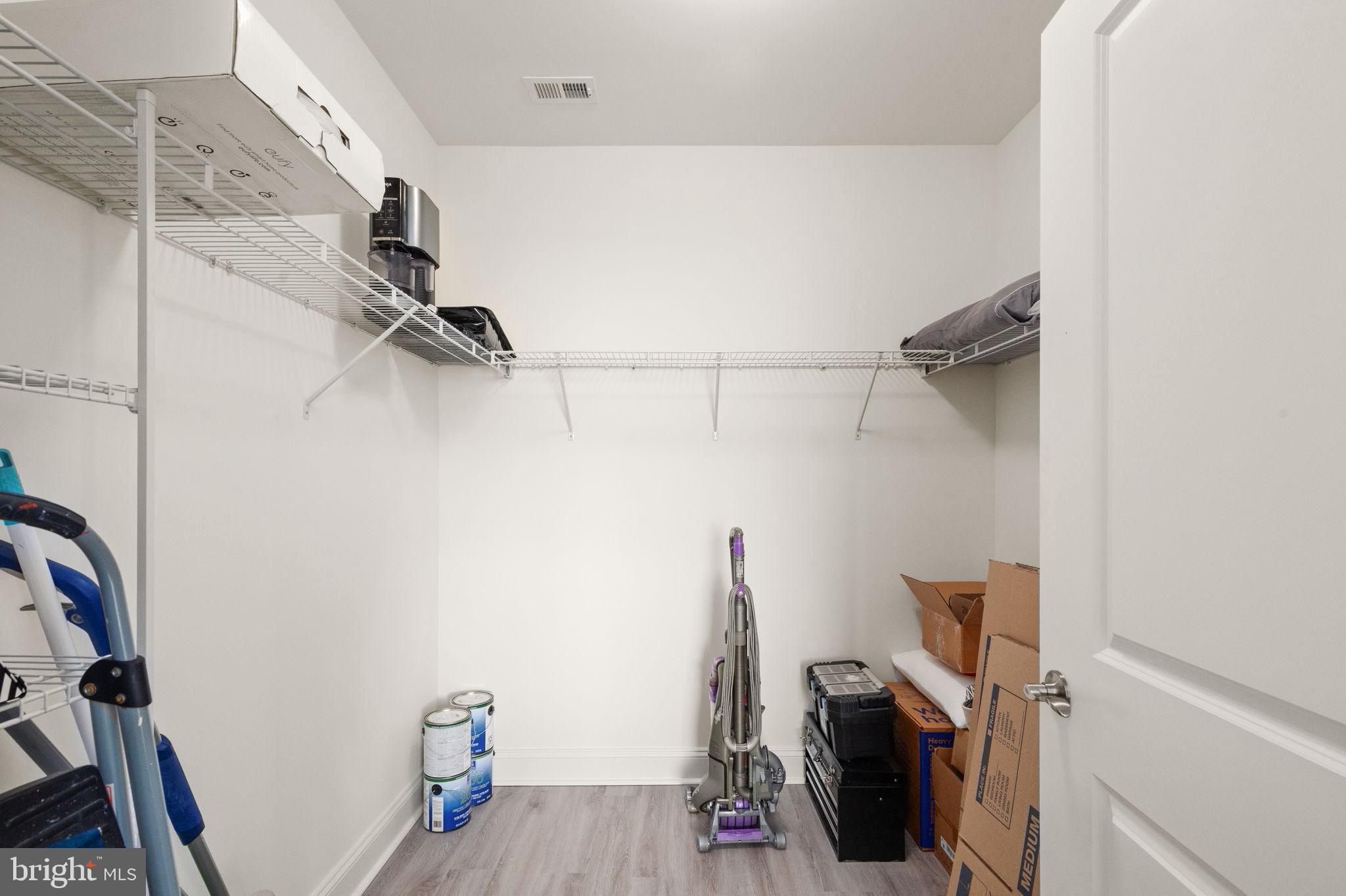 406 Bold Ruler Court, Unit 207 Havre de Grace, MD 21078 - Photo 22 of 57 a view of walk in closet with clothes and shoes
