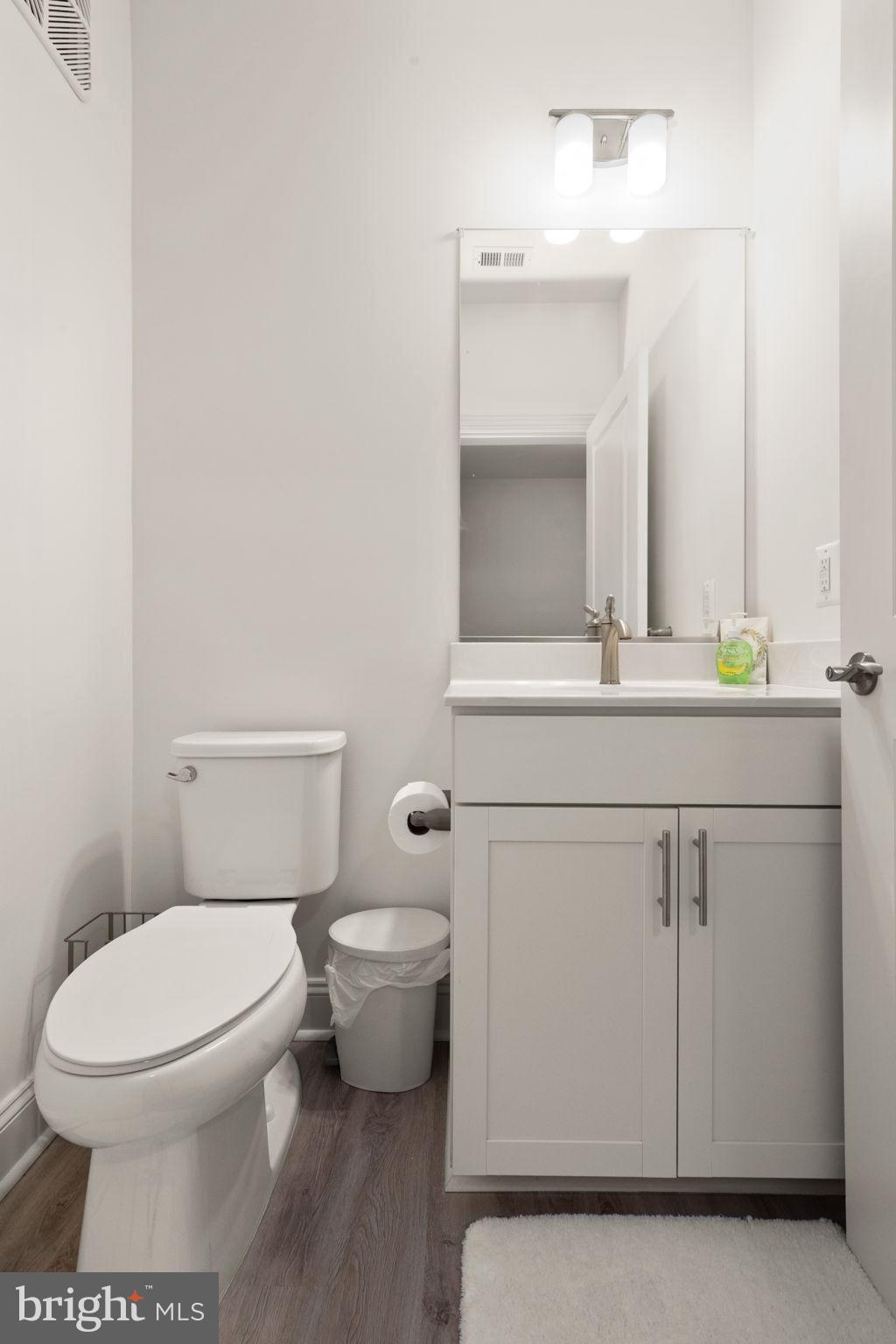 406 Bold Ruler Court, Unit 207 Havre de Grace, MD 21078 - Photo 23 of 57 a bathroom with a toilet sink and mirror