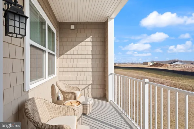 a view of a balcony with furniture
