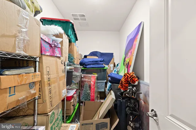 a view of a hallway with a ceiling fan