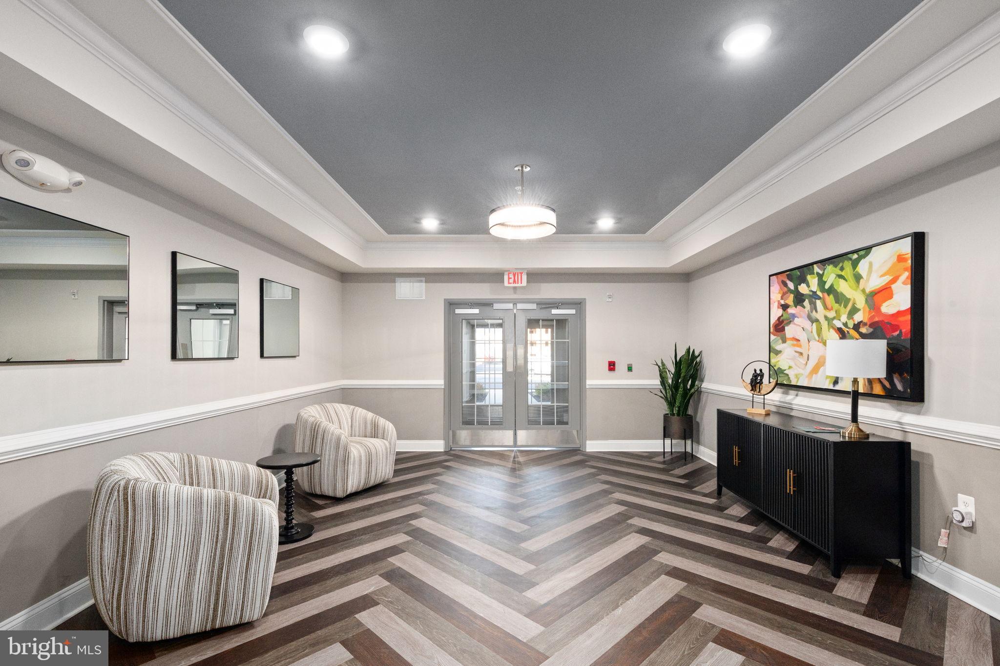 406 Bold Ruler Court, Unit 207 Havre de Grace, MD 21078 - Photo 30 of 57 a living room with furniture and a flat screen tv