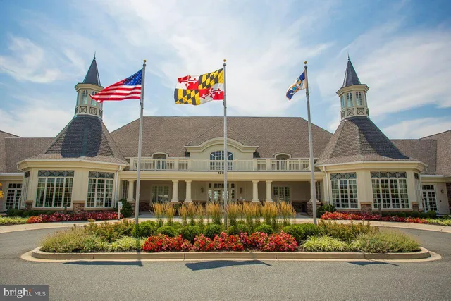 a room with gym equipment and a flat screen tv