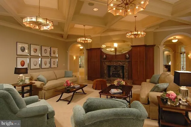 a roof deck with couches and potted plants