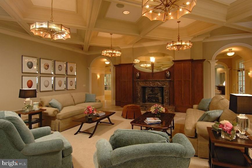 406 Bold Ruler Court, Unit 207 Havre de Grace, MD 21078 - Photo 37 of 57 a living room with furniture a chandelier and a flat screen tv