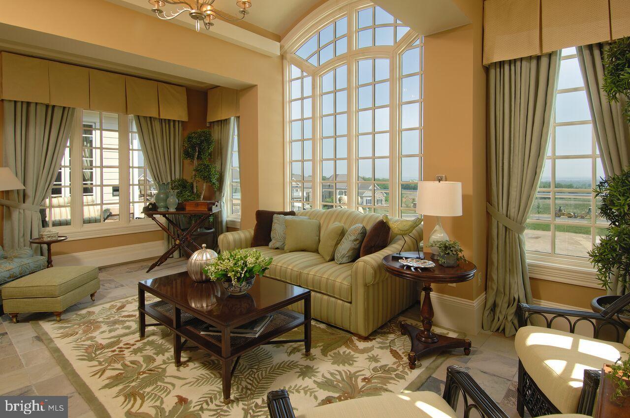 406 Bold Ruler Court, Unit 207 Havre de Grace, MD 21078 - Photo 44 of 57 a living room with furniture and a large window