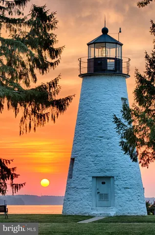 a group of people sitting in a yard