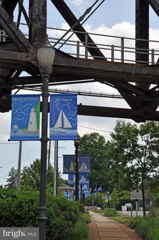 a view of water with boats and trees in the background