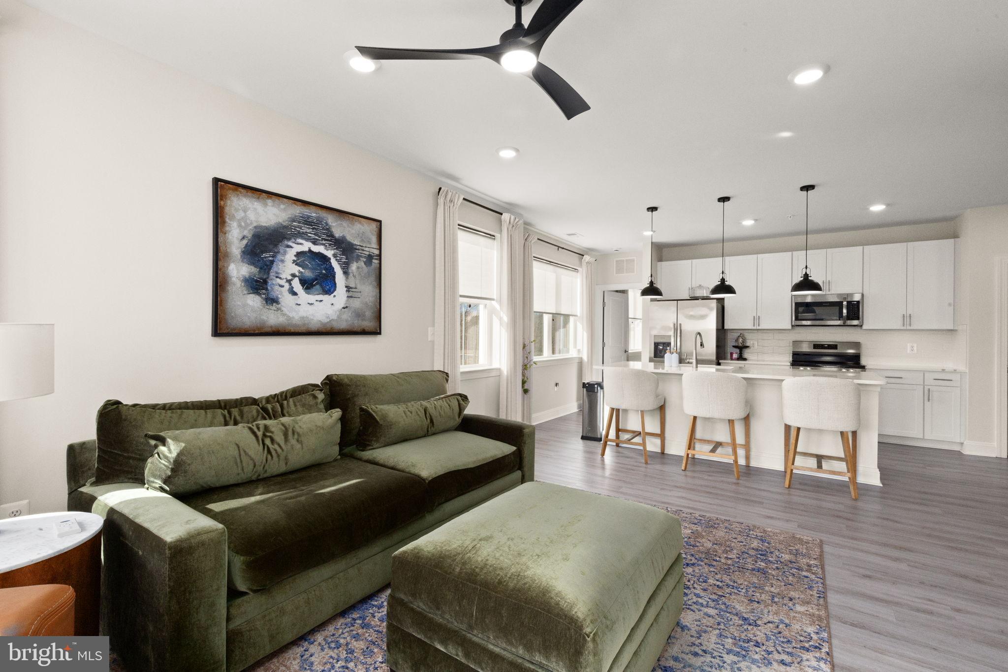 406 Bold Ruler Court, Unit 207 Havre de Grace, MD 21078 - Photo 9 of 57 a living room with furniture and kitchen view