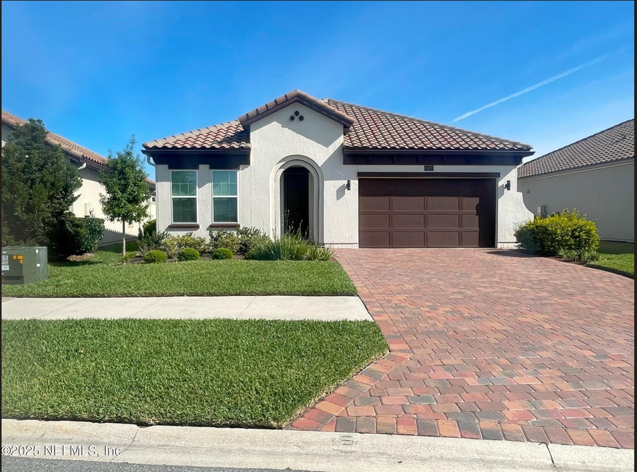 2489 Caprera Circle Jacksonville, FL 32246 - Photo 1 of 30 a front view of a house with a yard