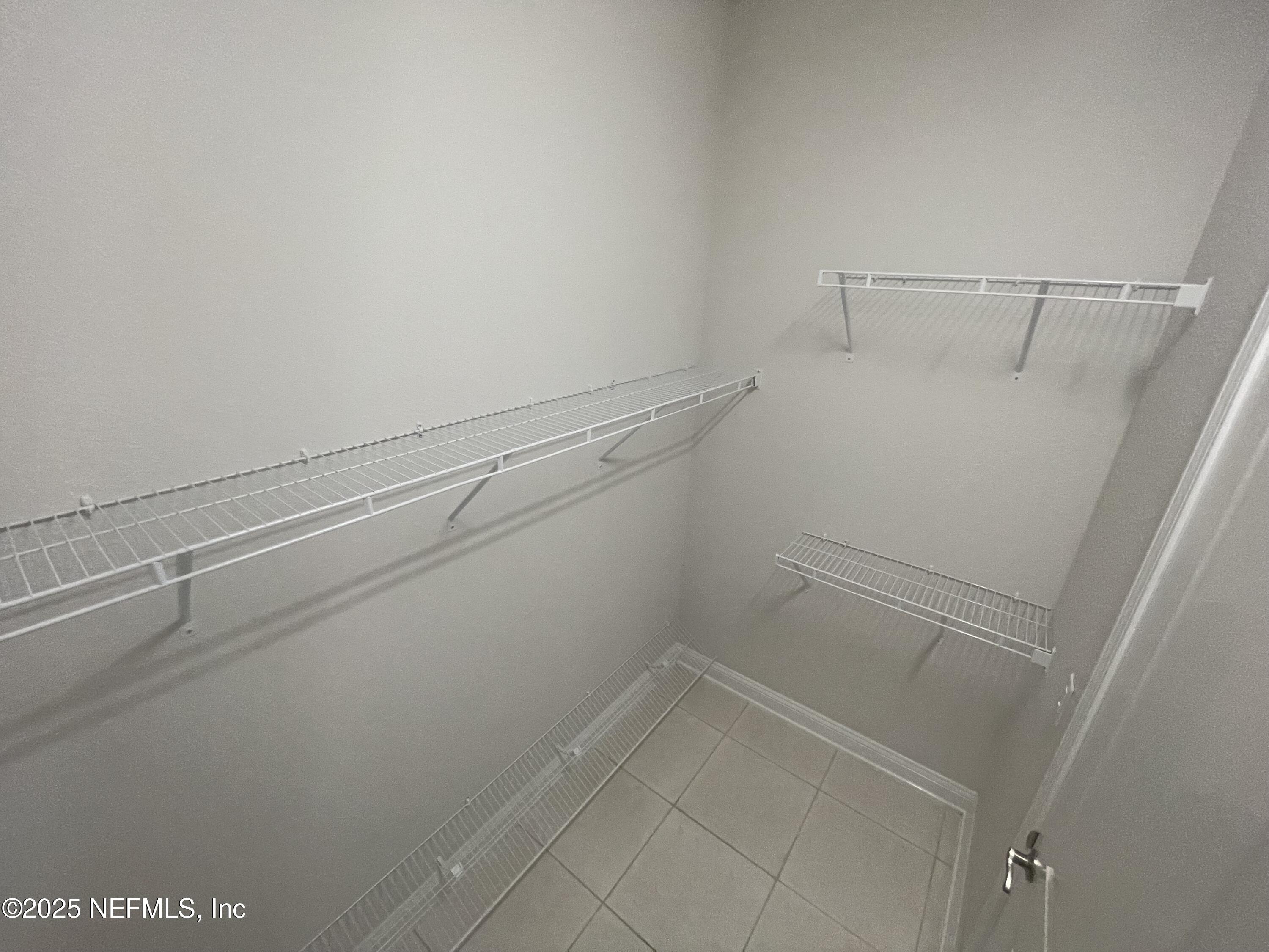 2489 Caprera Circle Jacksonville, FL 32246 - Photo 20 of 30 a view of a room with racks on the wall