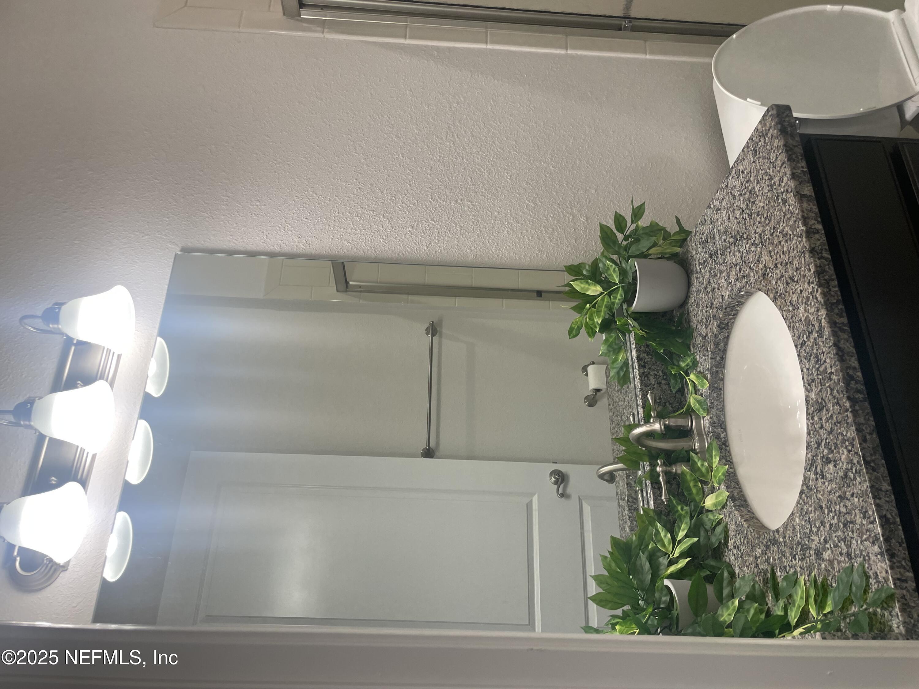 2489 Caprera Circle Jacksonville, FL 32246 - Photo 25 of 30 a view of kitchen with furniture and wooden floor