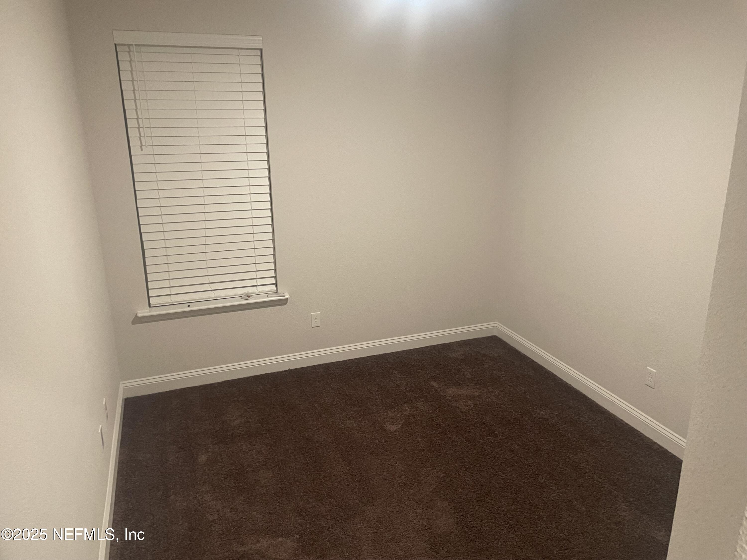 2489 Caprera Circle Jacksonville, FL 32246 - Photo 27 of 30 an empty room with a window