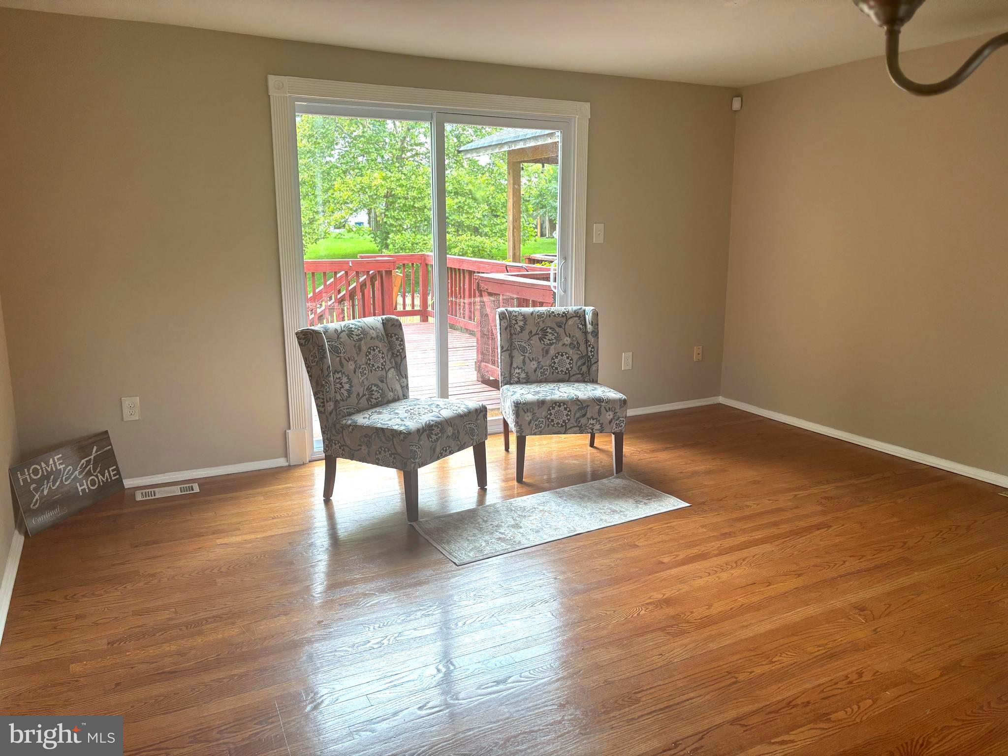 3423 Castle Way, Unit 10432 Silver Spring, MD 20904 - Photo 1 of 9 a view of a livingroom with furniture and a window