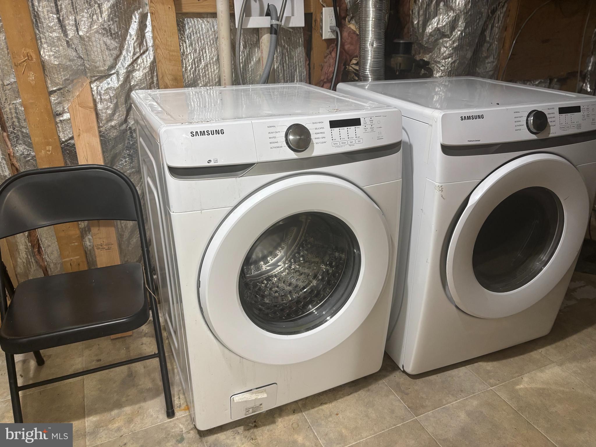 3423 Castle Way, Unit 10432 Silver Spring, MD 20904 - Photo 4 of 9 a utility room with dryer and washer