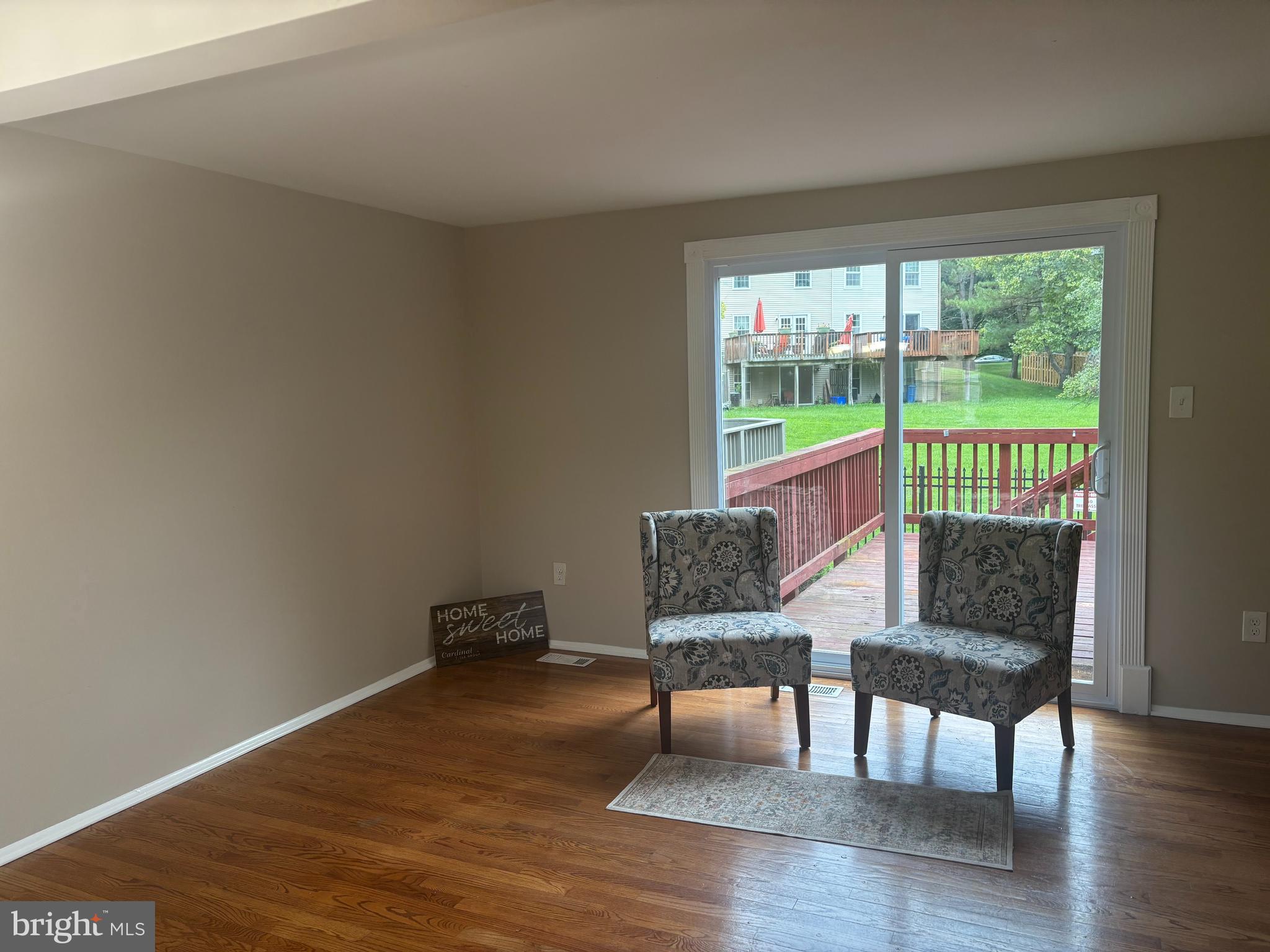 3423 Castle Way, Unit 10432 Silver Spring, MD 20904 - Photo 6 of 9 a living room with furniture and a window