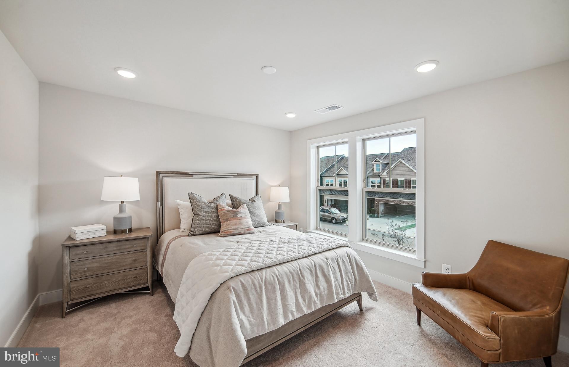 8065 Jennys Way Fulton, MD 20759 - Photo 13 of 17 a bedroom with a bed couch and window