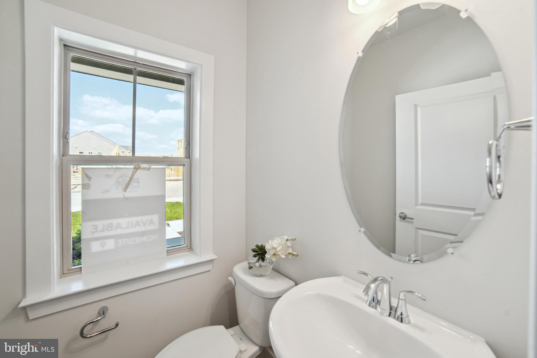 8065 Jennys Way Fulton, MD 20759 - Photo 4 of 17 a bathroom with a sink a toilet and a mirror