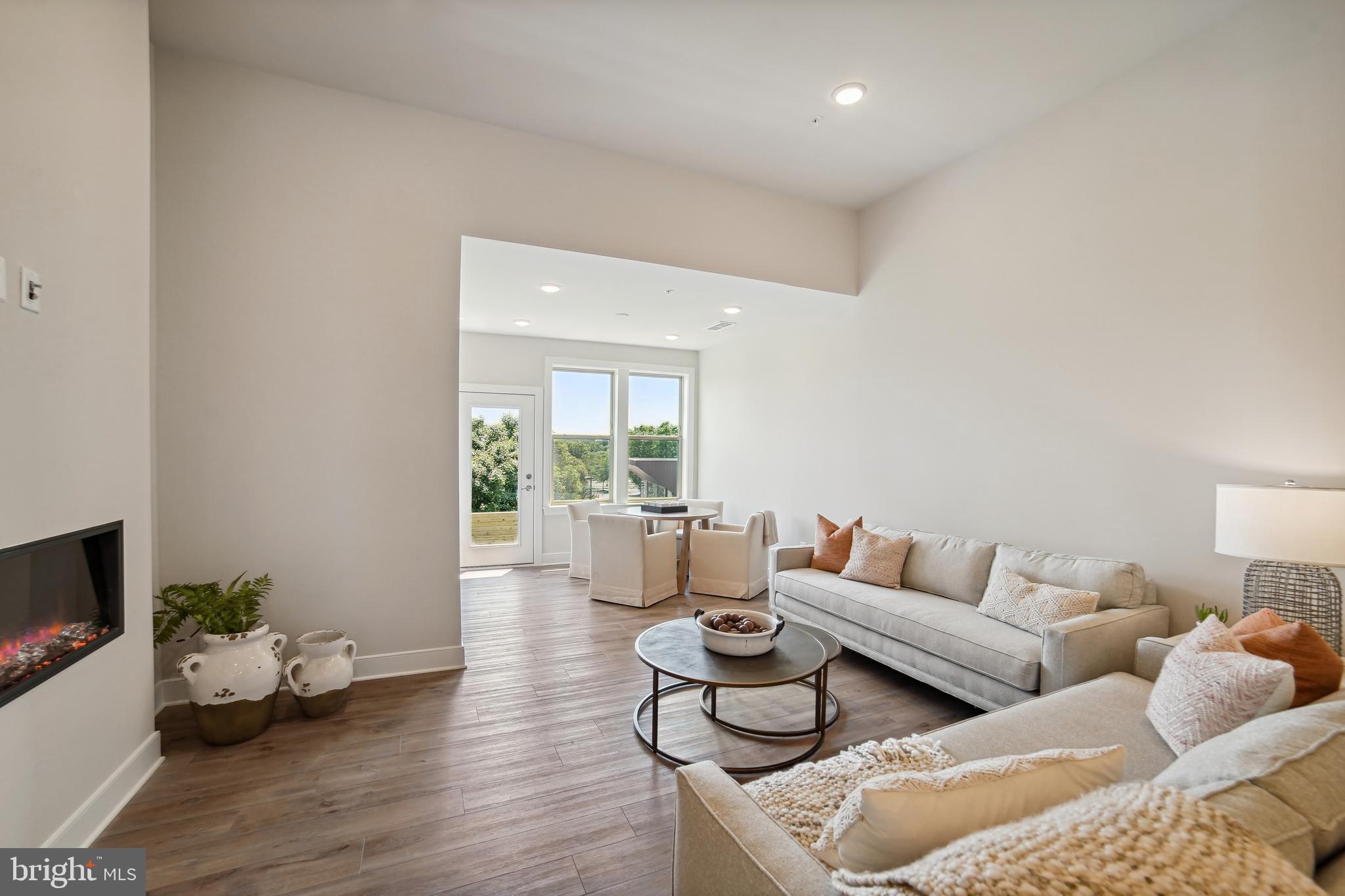8065 Jennys Way Fulton, MD 20759 - Photo 6 of 17 a living room with furniture couches and a flat screen tv