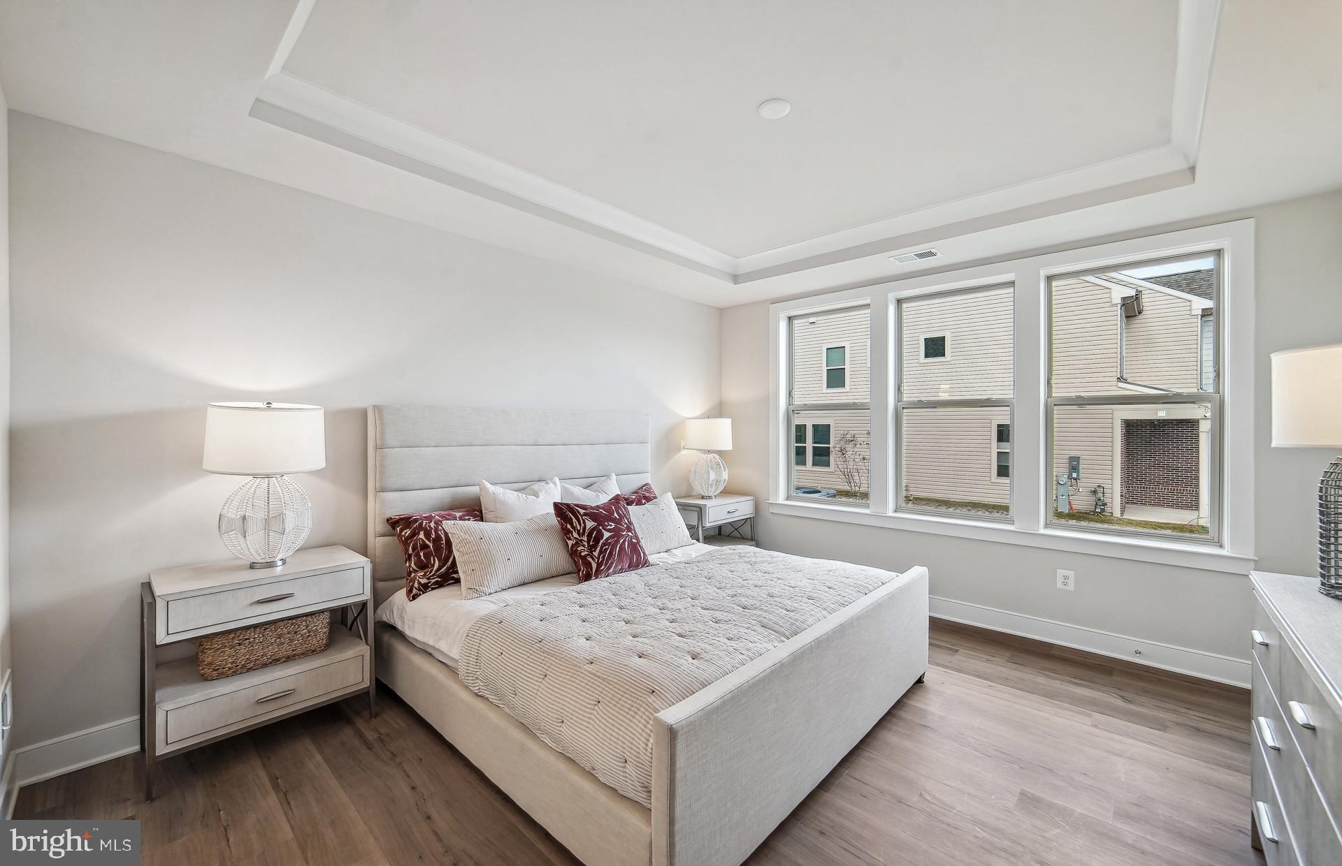 8065 Jennys Way Fulton, MD 20759 - Photo 7 of 17 a bedroom with a large bed and a window