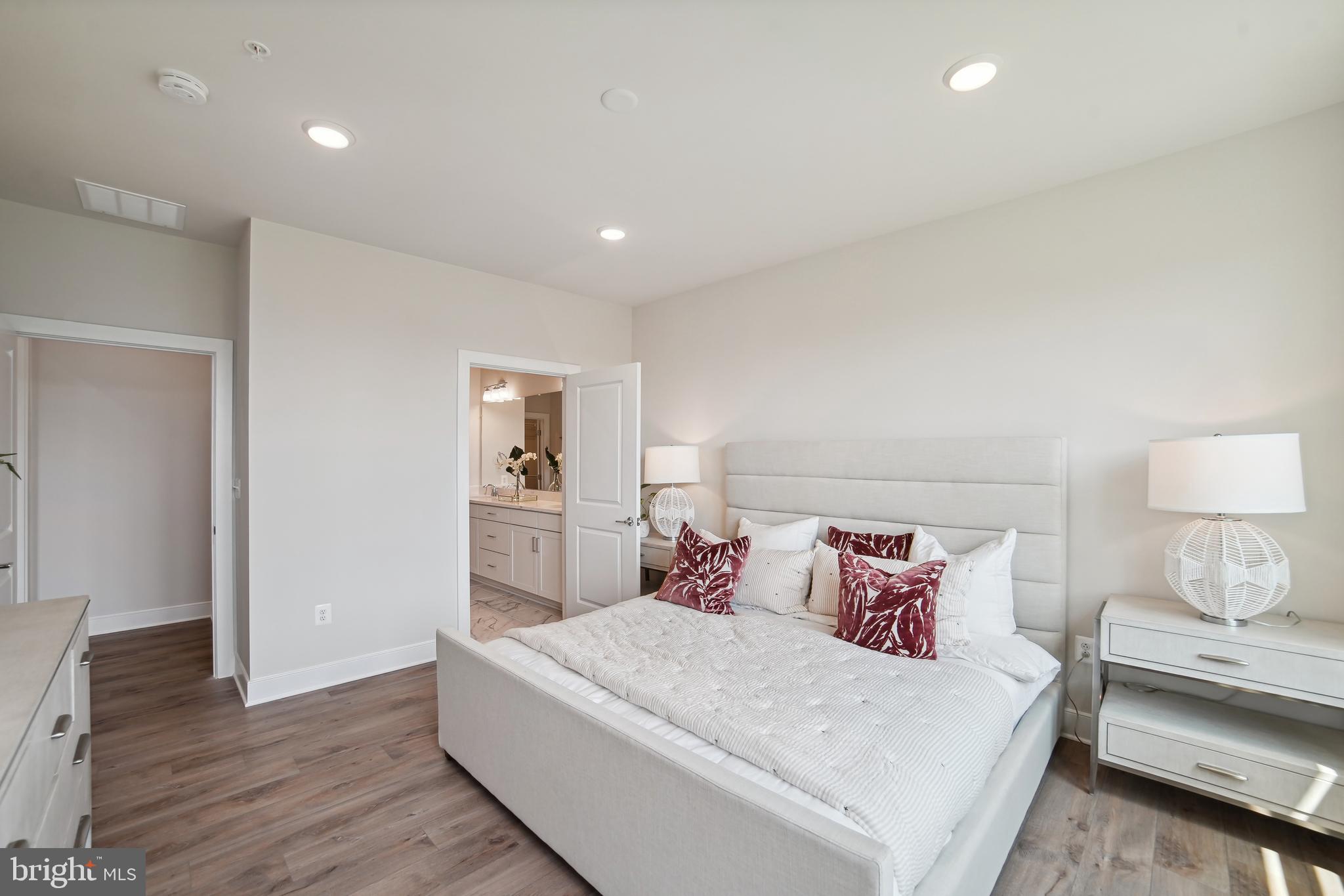 8065 Jennys Way Fulton, MD 20759 - Photo 8 of 17 a bedroom with a bed and wooden floor