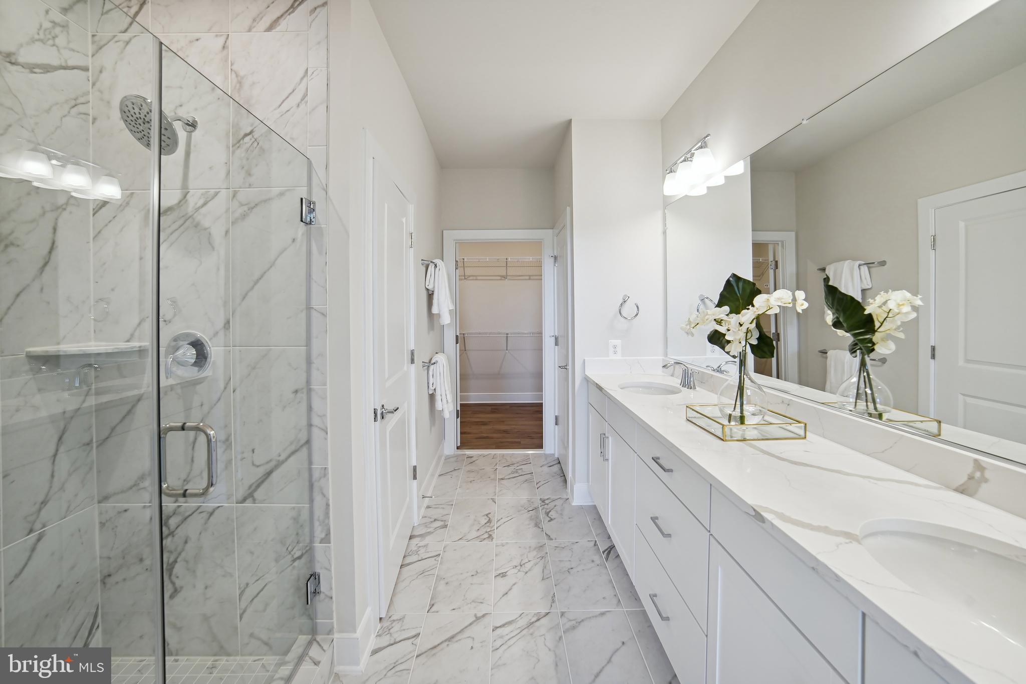 8065 Jennys Way Fulton, MD 20759 - Photo 9 of 17 a spacious bathroom with a double vanity sink shower and a mirror