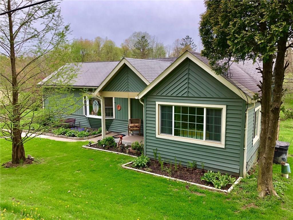 Cute as a button with space to roam on 2.86 acres.