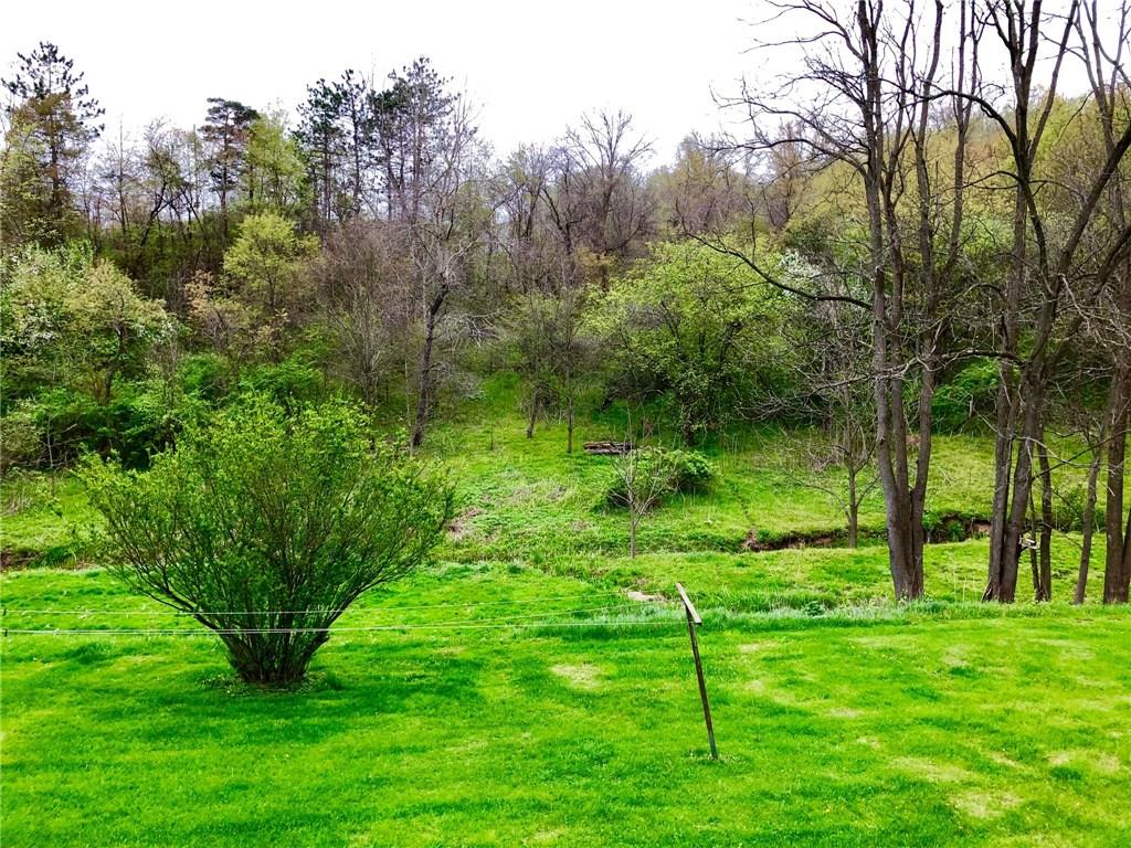 650 Shaffer Road Hookstown, PA 15050 - Photo 23 of 25 Taken from the Deck at the rear of the property and showing a mix of grass and trees. Fairly level terrain with a small babbling brook.