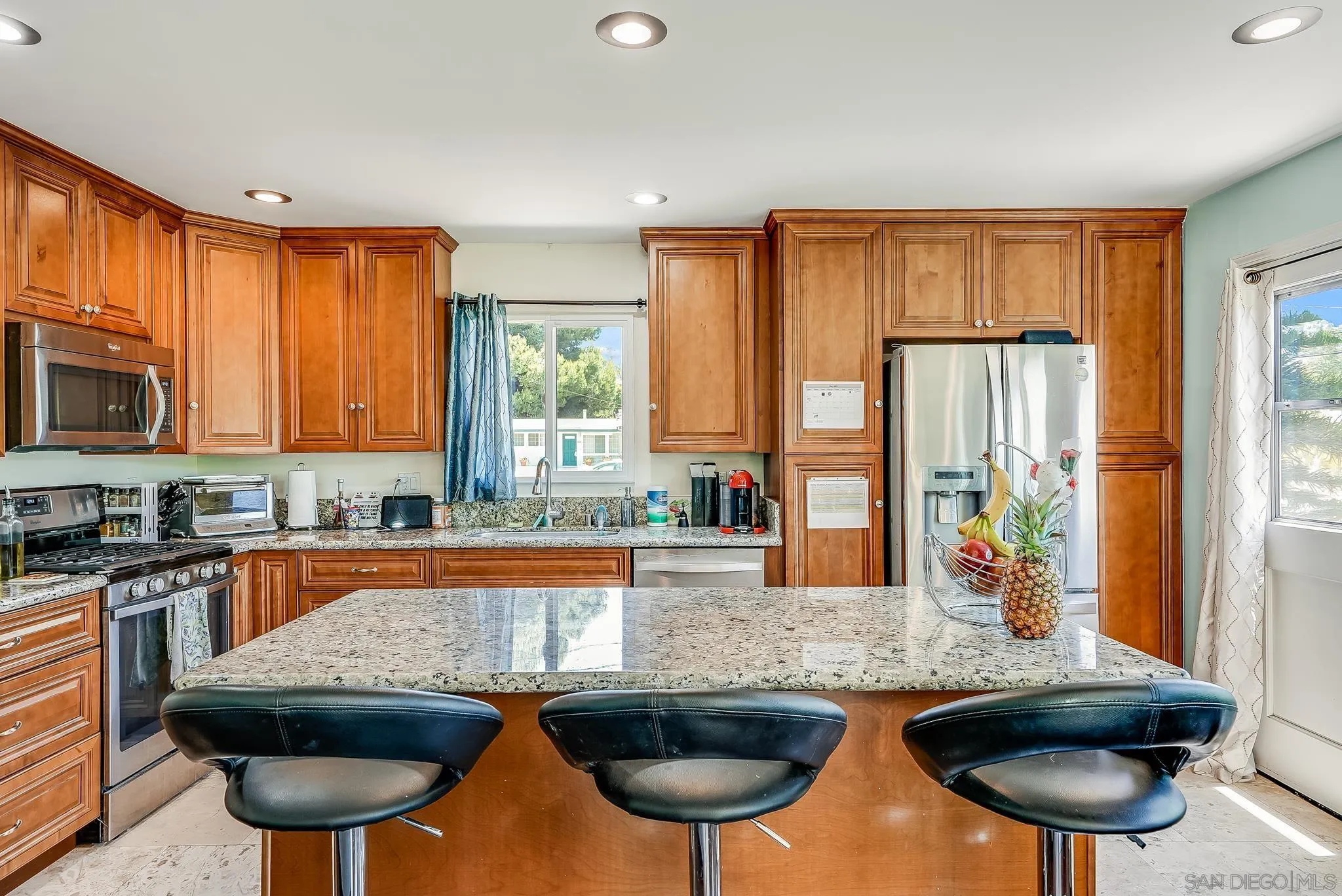 13902 Powers Road Poway, CA 92064 - Photo 12 of 32 a kitchen with stainless steel appliances granite countertop a sink and cabinets