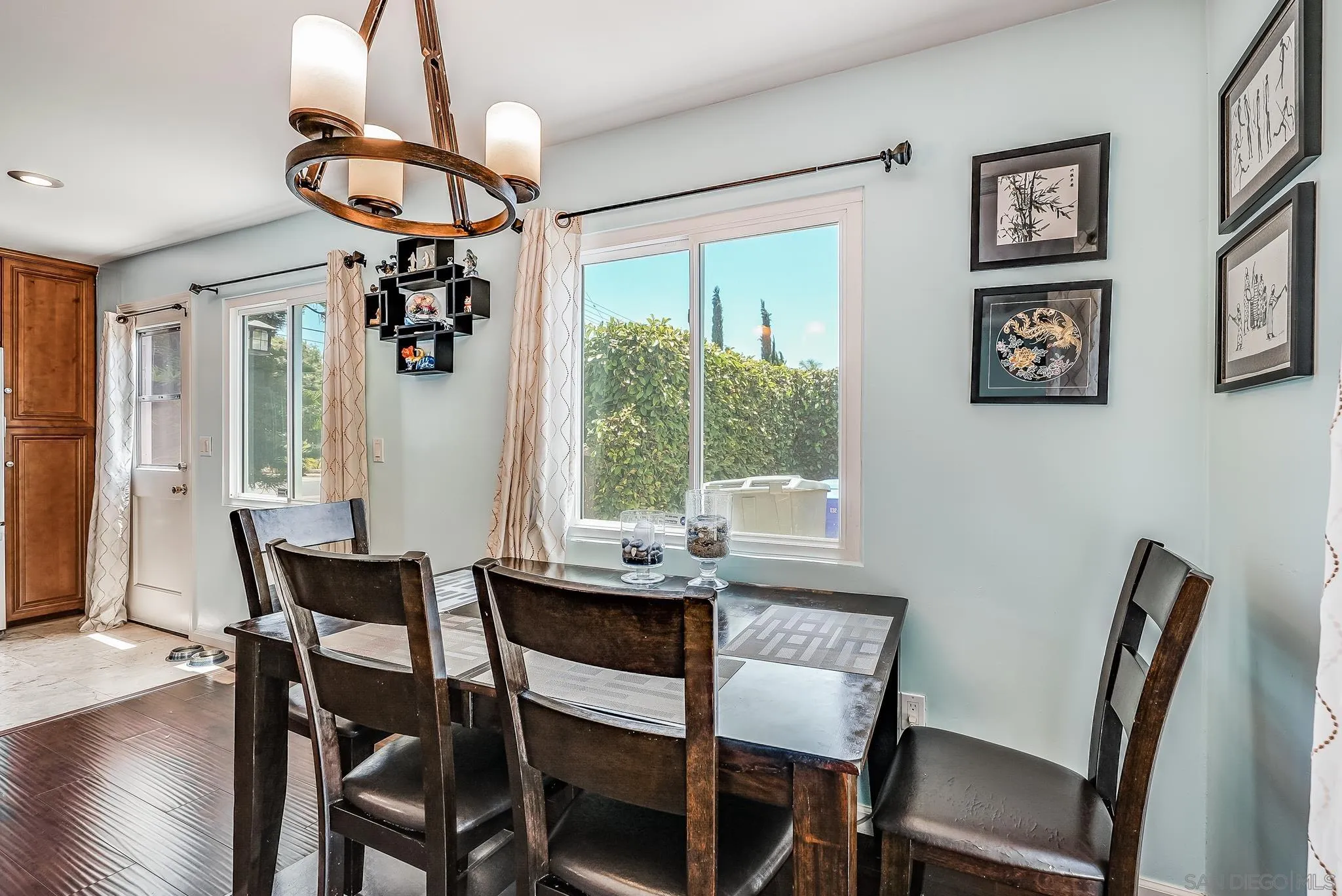 13902 Powers Road Poway, CA 92064 - Photo 14 of 32 a view of a dining room with furniture wooden floor and chandelier