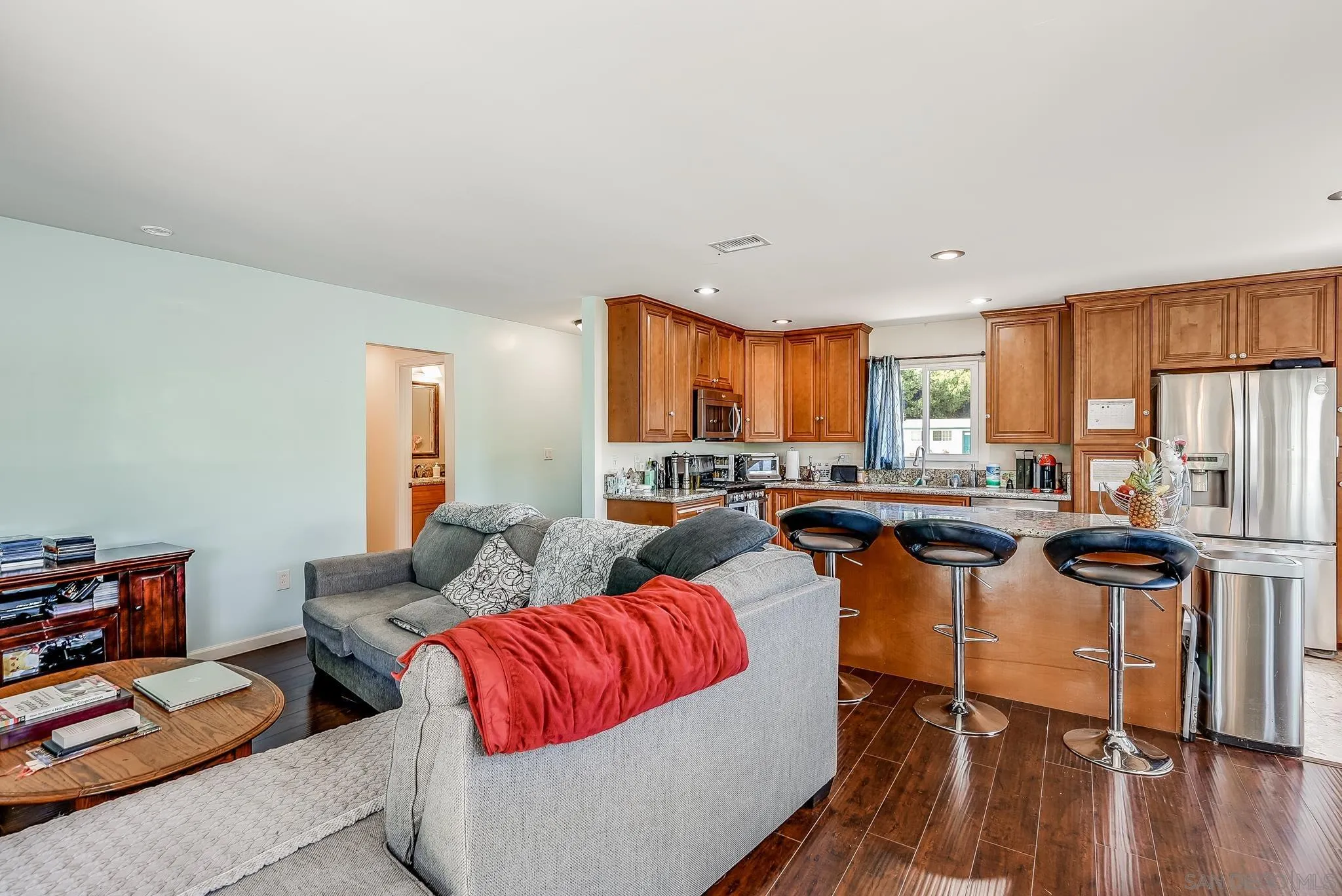13902 Powers Road Poway, CA 92064 - Photo 17 of 32 a living room with furniture kitchen view and a large window