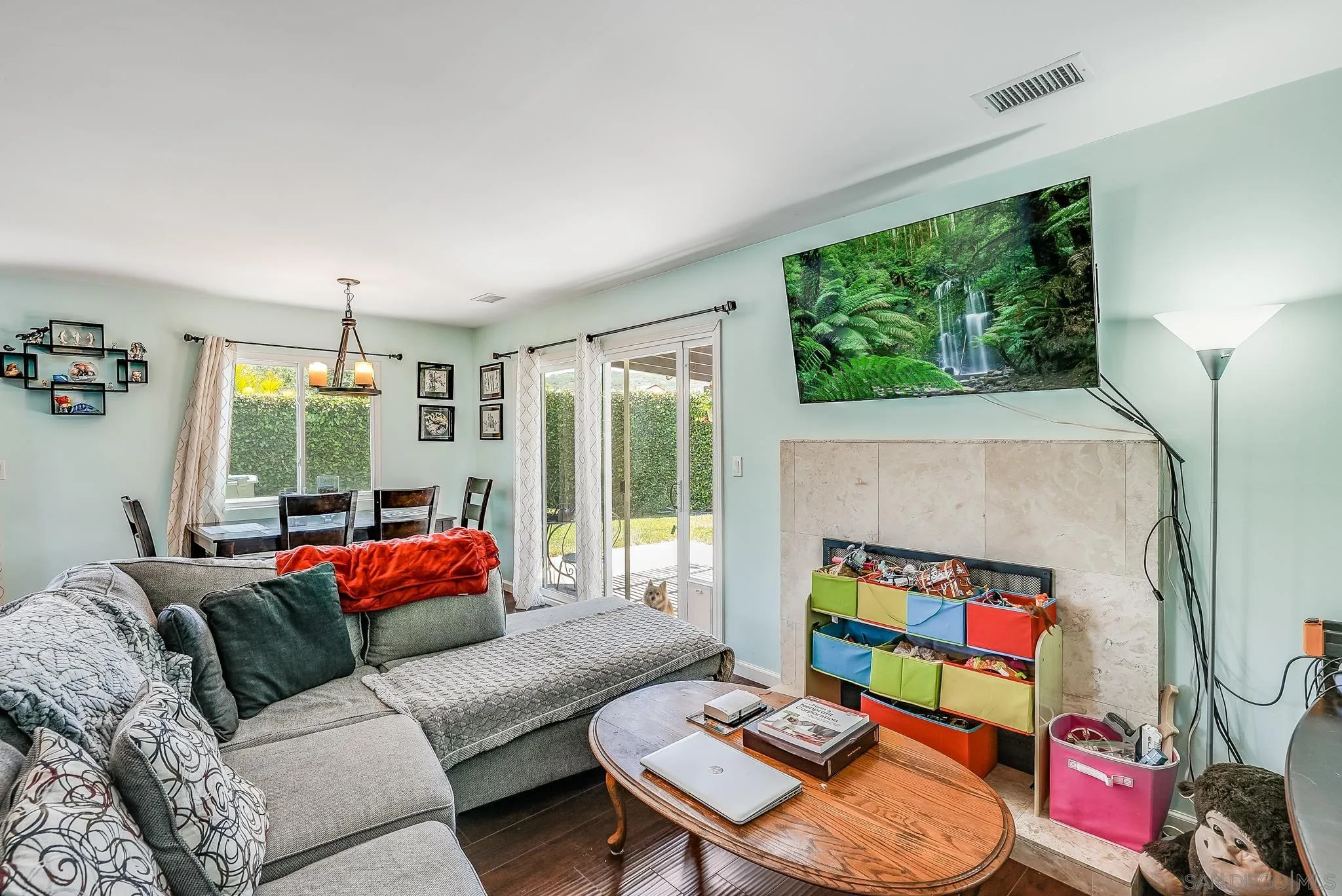 13902 Powers Road Poway, CA 92064 - Photo 19 of 32 a living room with furniture and a flat screen tv