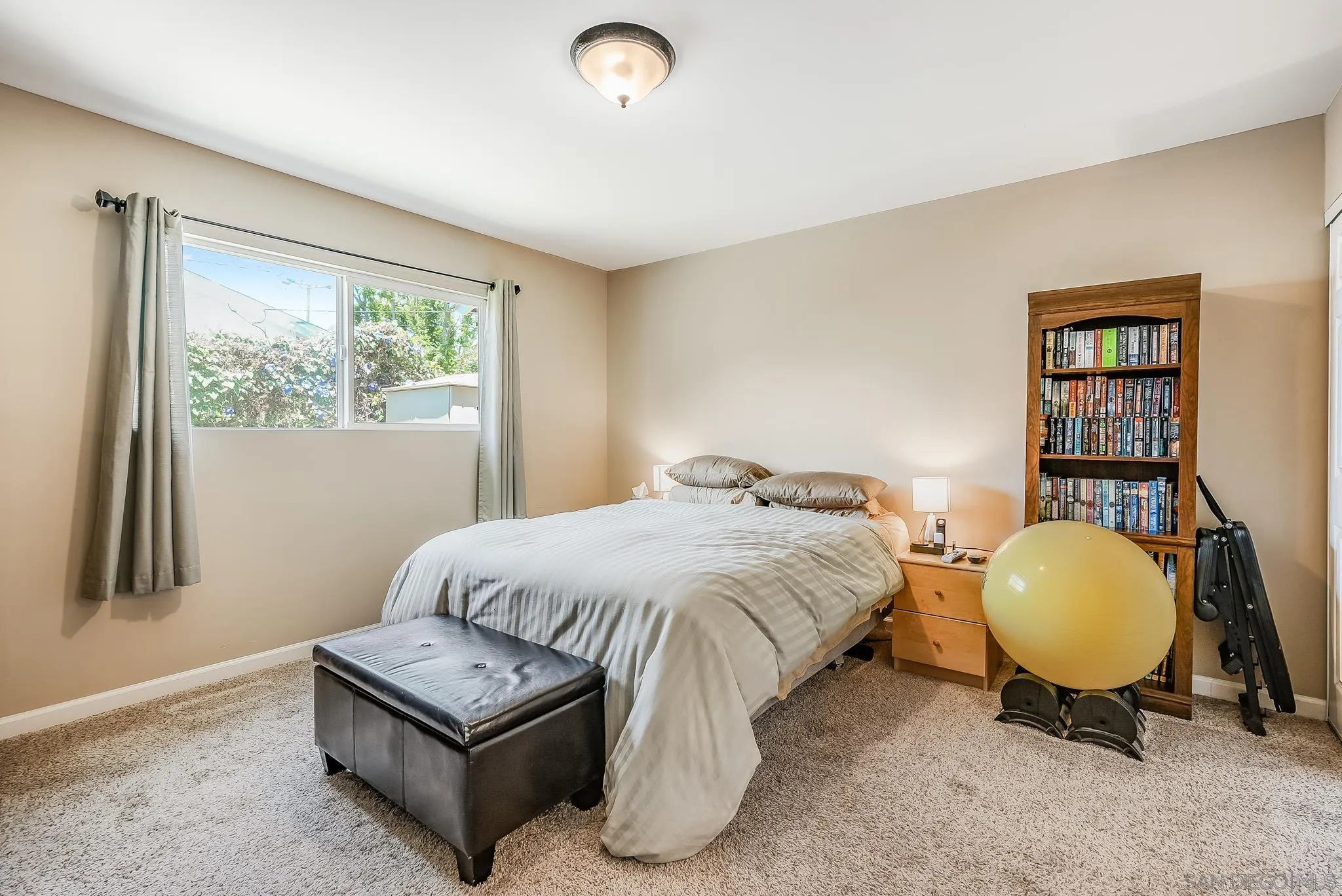 13902 Powers Road Poway, CA 92064 - Photo 27 of 32 a bedroom with a bed chair and window