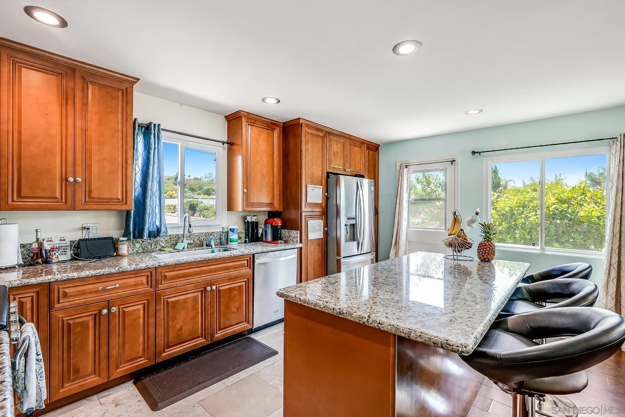 13902 Powers Road Poway, CA 92064 - Photo 9 of 32 a kitchen with granite countertop a sink and cabinets