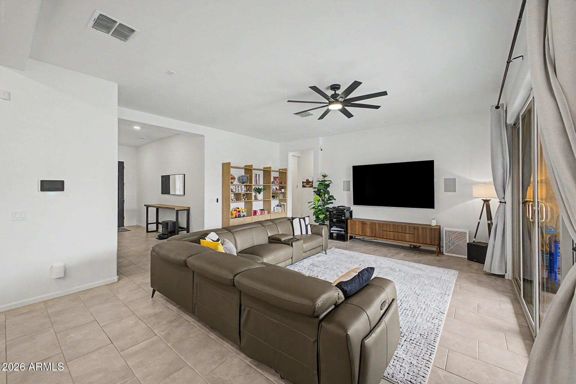 6511 West Steed Ridge Phoenix, AZ 85083 - Photo 7 of 41 a living room with furniture and a flat screen tv