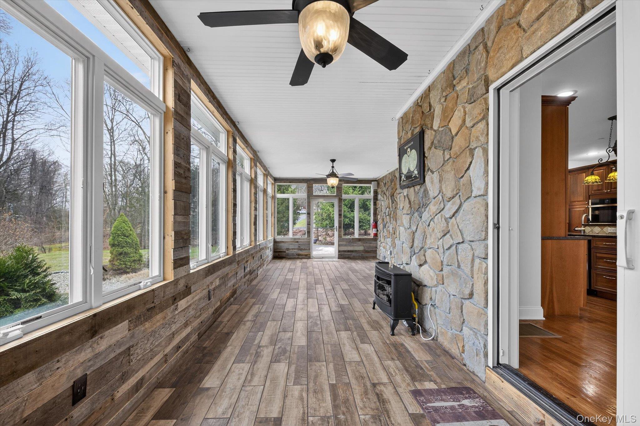 7 Farm Hollow Road New Windsor, NY 12553 - Photo 14 of 36 Unfurnished sunroom with a ceiling fan