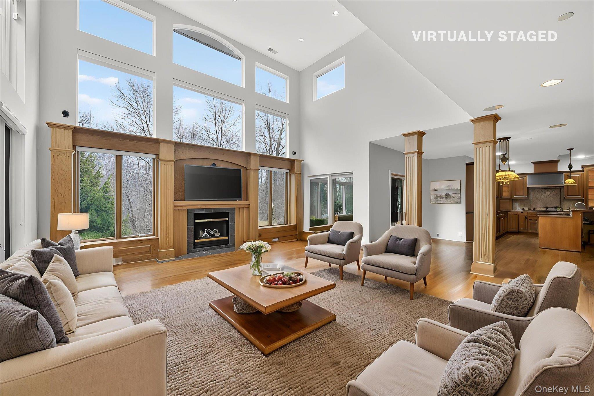 7 Farm Hollow Road New Windsor, NY 12553 - Photo 15 of 36 Living room featuring wood finished floors, a fireplace, recessed lighting, and a high ceiling