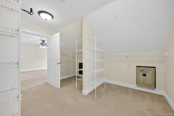 a spacious bathroom with a tub shower and windows