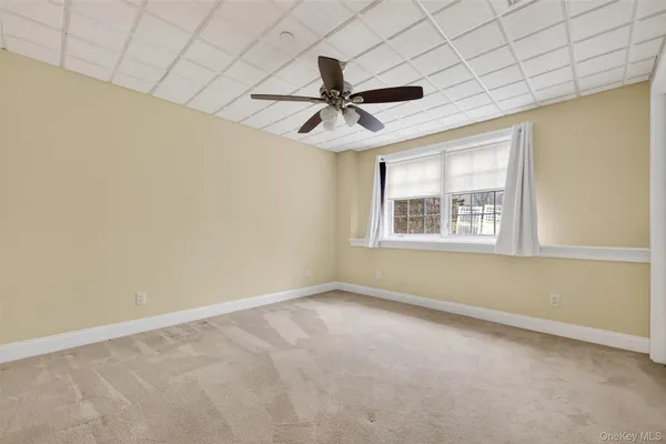 a view of an empty room with a balcony