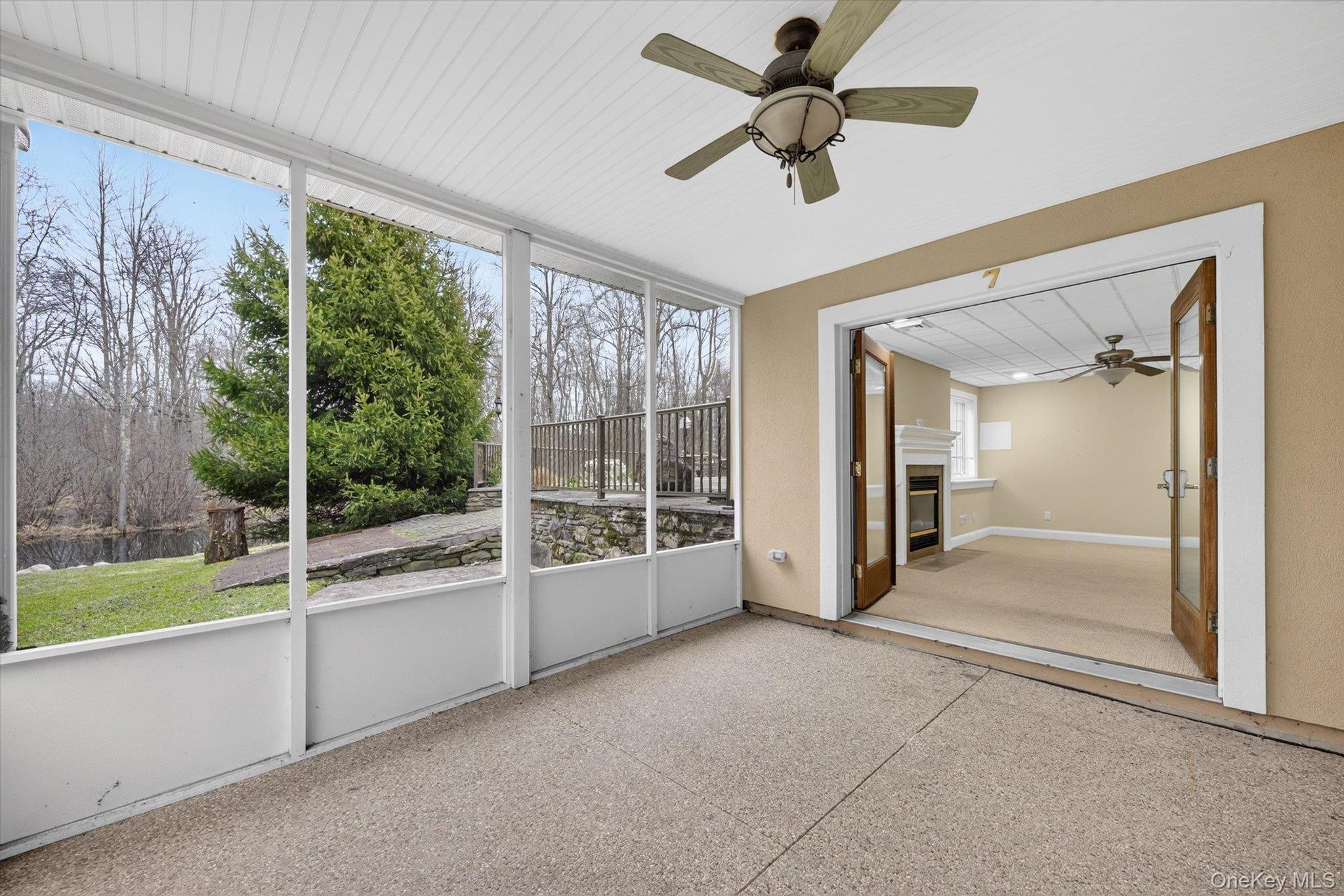 7 Farm Hollow Road New Windsor, NY 12553 - Photo 28 of 36 Unfurnished sunroom with ceiling fan and a glass covered fireplace