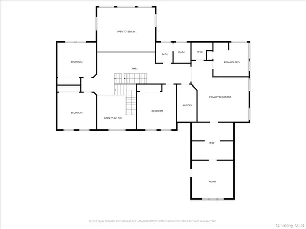 a front view of a house with a tree