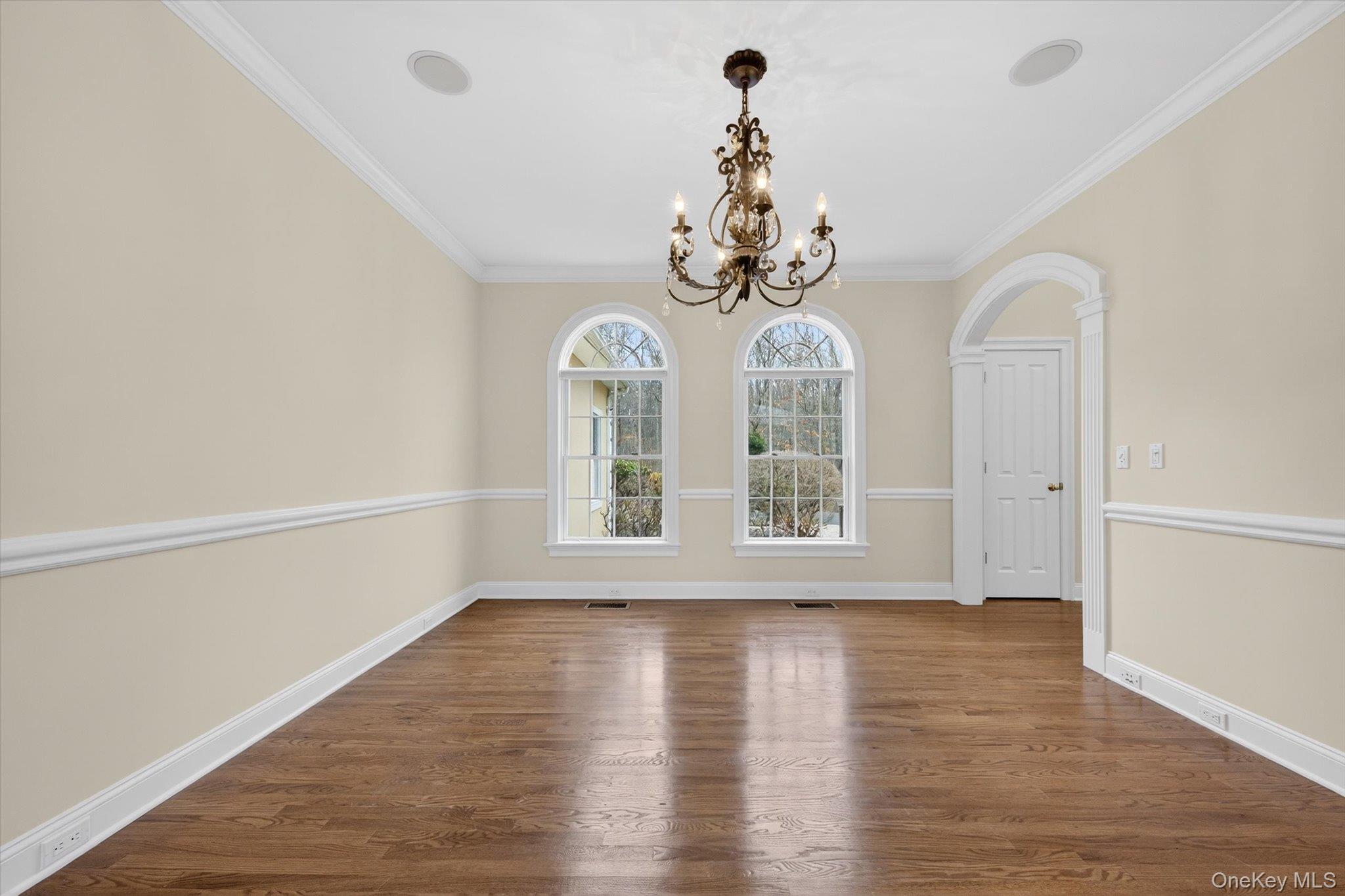7 Farm Hollow Road New Windsor, NY 12553 - Photo 7 of 36 Unfurnished dining area featuring dark wood-type flooring, suspended lighting, and crown molding