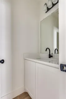 a bathroom with a sink and mirror