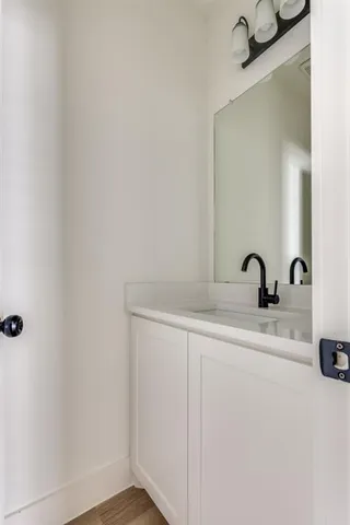 a bathroom with a sink and mirror