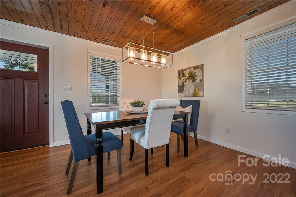 1790 Baber Road Rutherfordton, NC 28139 - Photo 10 of 26 a view of a dining room with furniture window and wooden floor